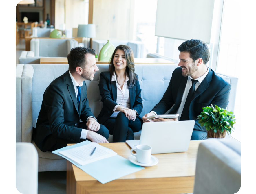 Business professionals meeting on a couch.